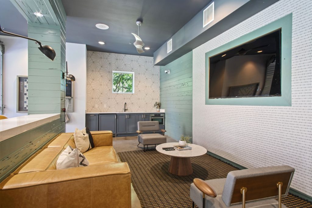 interior resident gaming lounge with a couch seating and tv