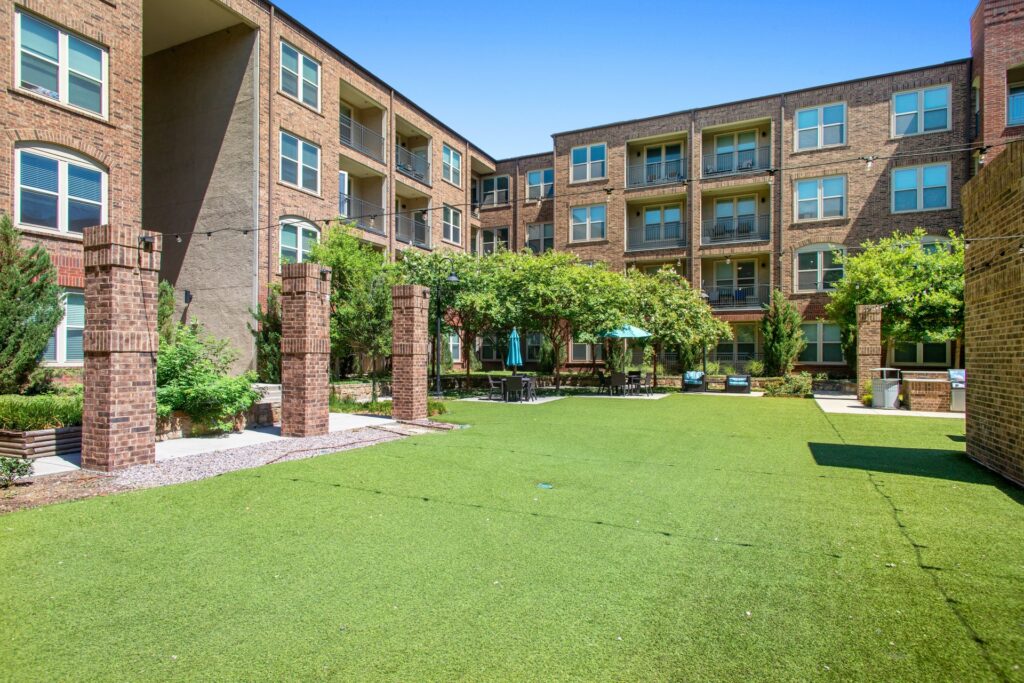 exterior courtyard turff with patio string lights